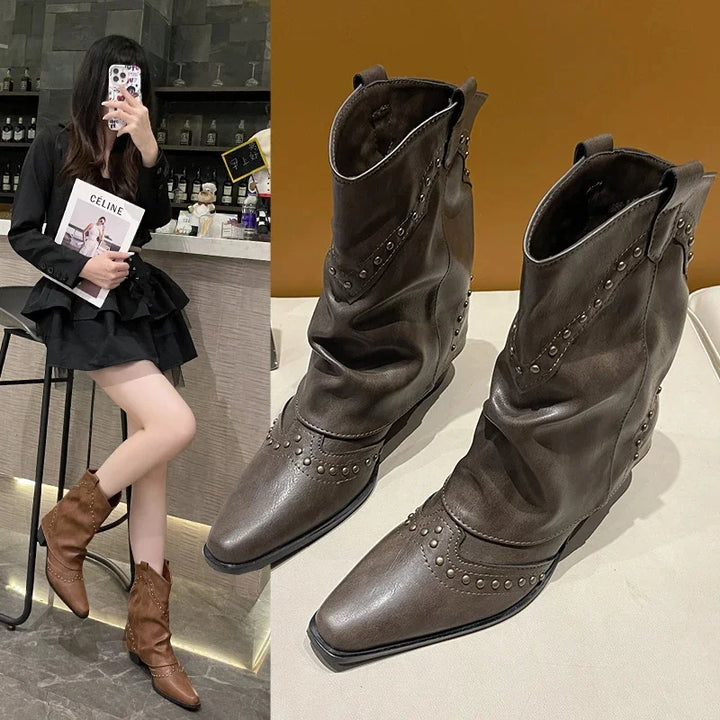 Edgy women's mid-calf western boots with studs, pointed toe, comfortable block heel.
