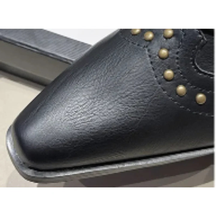 Black western boots with studs for women, mid-calf length, elegant pointed toe.