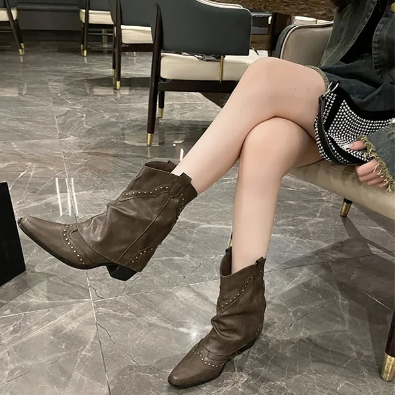 Women's studded western mid-calf boots, pointed toe, block heel, edgy fashion.