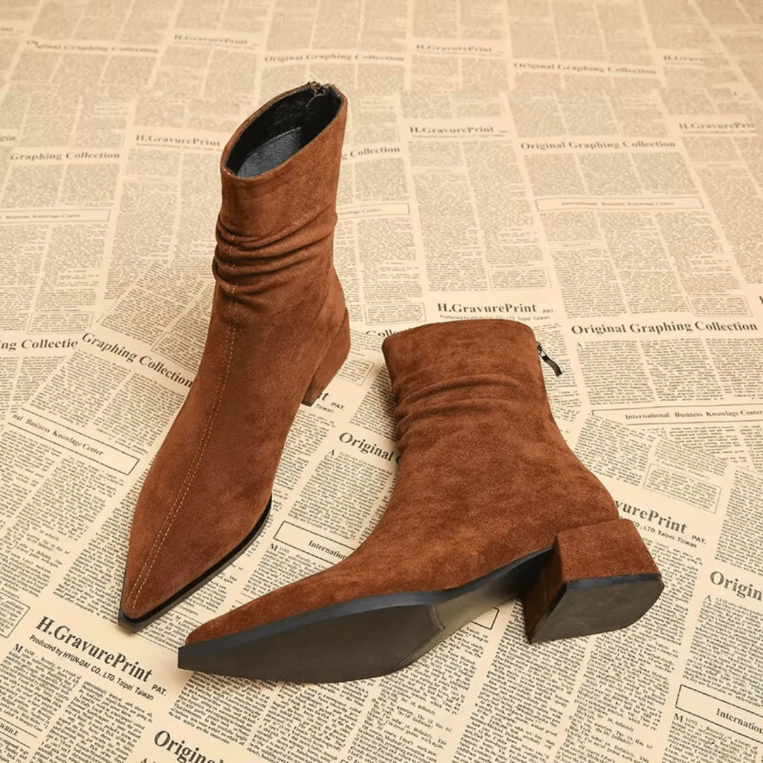 Stylish women's brown slouchy ankle boots. Versatile pointed toe & block heel are perfect for fall & winter outfits.