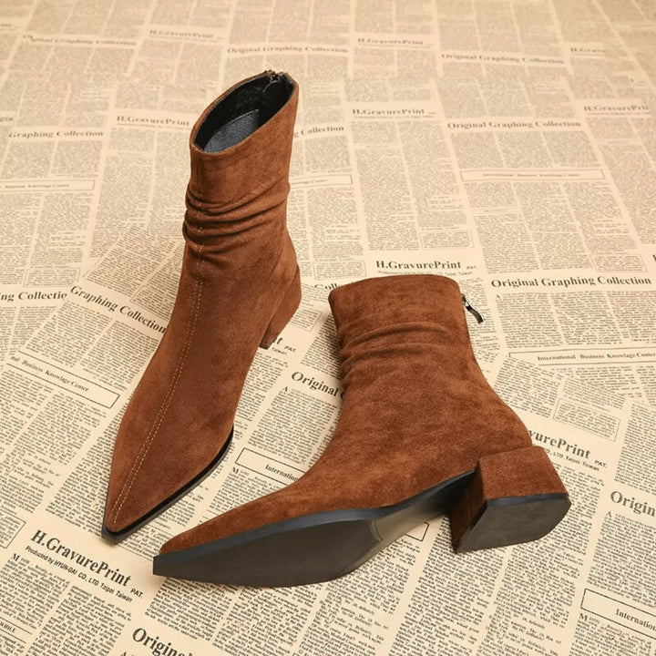 Stylish women's brown slouchy ankle boots. Versatile pointed toe & block heel are perfect for fall & winter outfits.