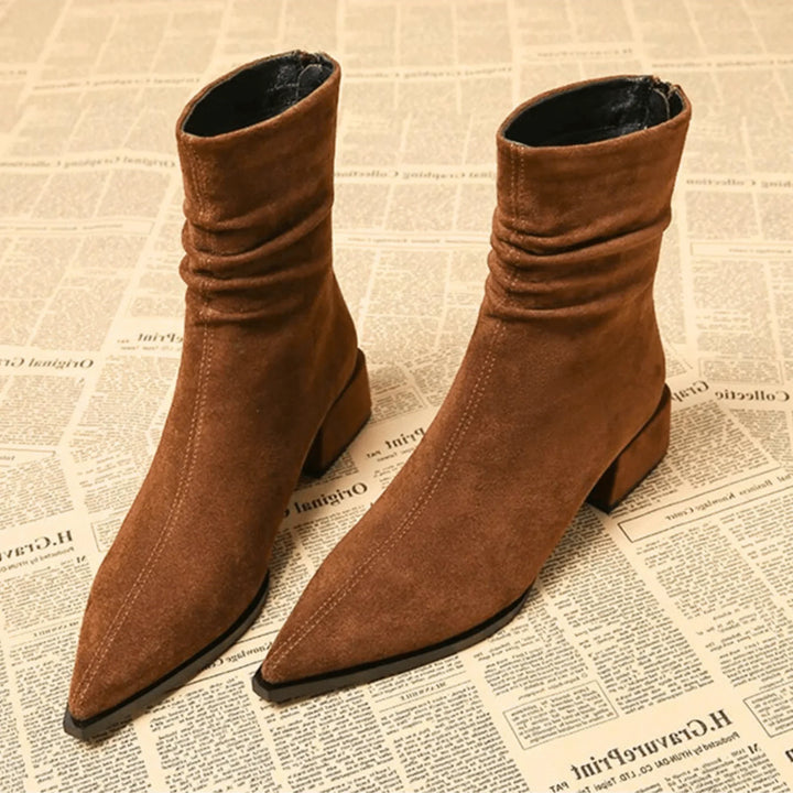 Women's brown slouchy ankle boots with pointed toe & block heel. Chic for casual or elegant fall fashion.