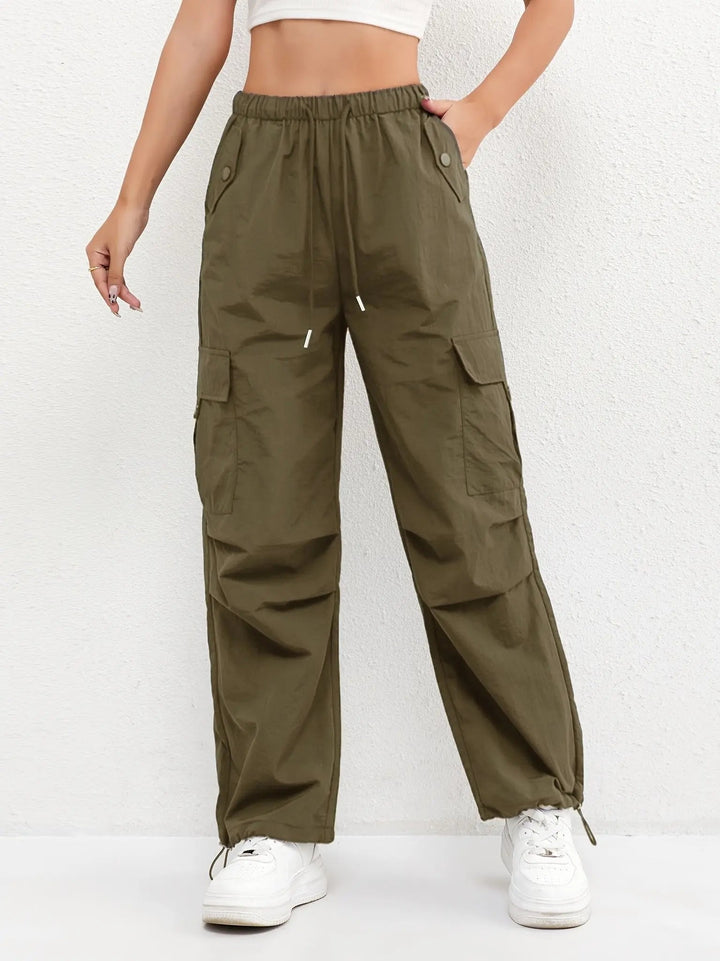 Relaxed fit women's parachute trousers in lightweight fabric, ideal for comfortable everyday wear & utility fashion.