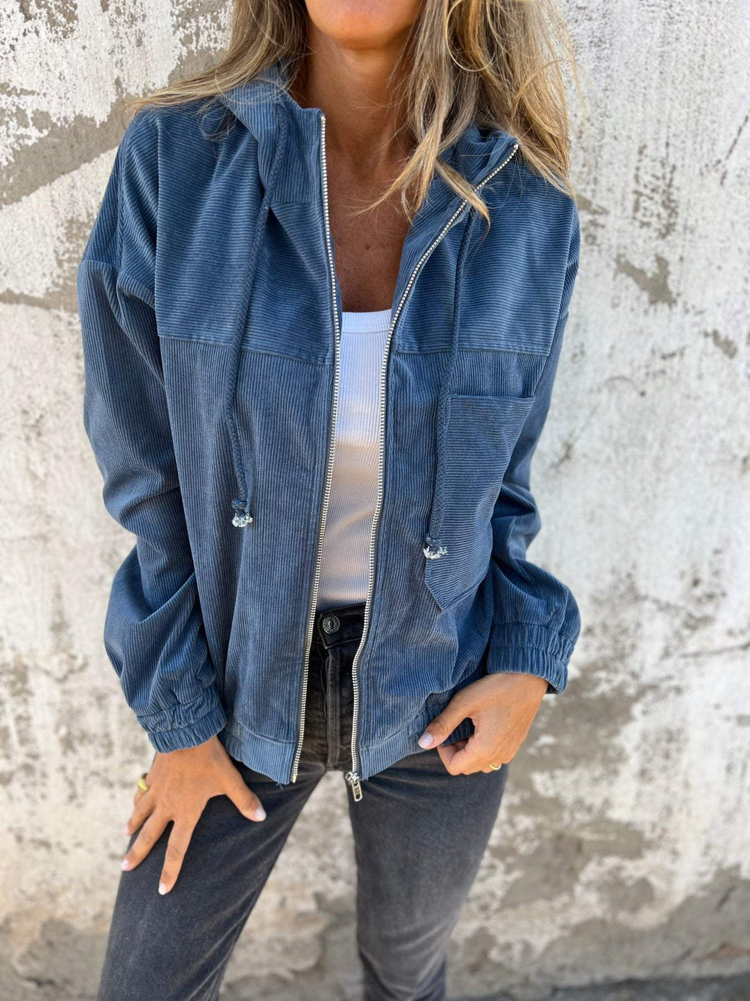 Women's casual hooded zip-up jacket, versatile and comfortable, featuring a zipper closure and a stylish design for women.
