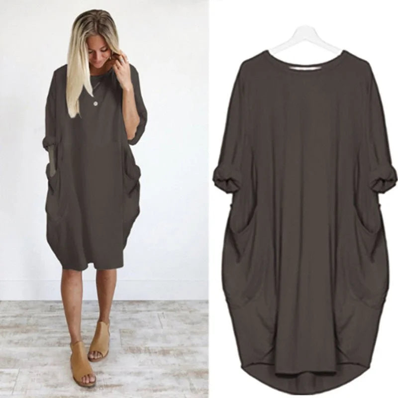 Front view: Casual oversized midi dress for women, 3/4 sleeves, and discreet side pockets for daily wear.