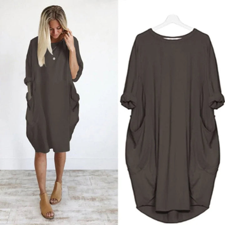 Front view: Casual oversized midi dress for women, 3/4 sleeves, and discreet side pockets for daily wear.
