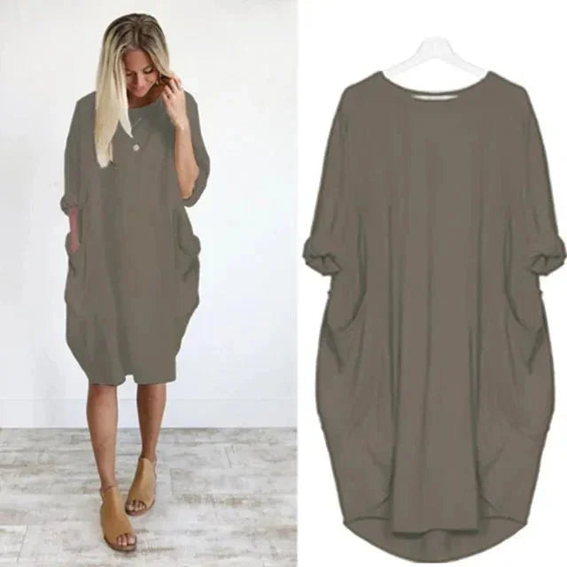Stylish women's oversized midi dress with relaxed 3/4 sleeves & practical side pockets. Perfect casual wear.