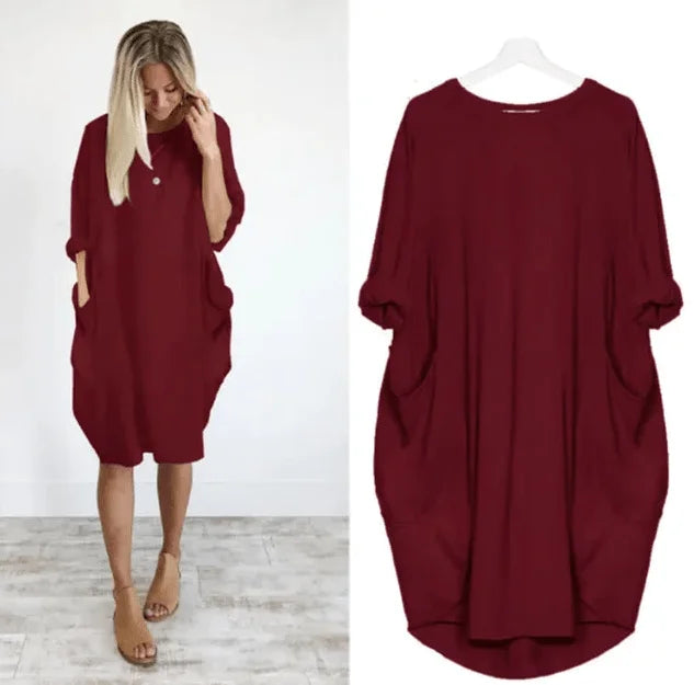 Flowy women's oversized midi dress for everyday wear, featuring 3/4 sleeves & convenient pockets.