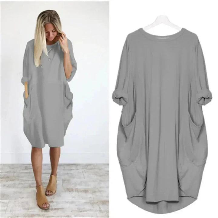 Plus size women's casual oversized midi dress, comfortable fit, 3/4 sleeves & essential pockets.
