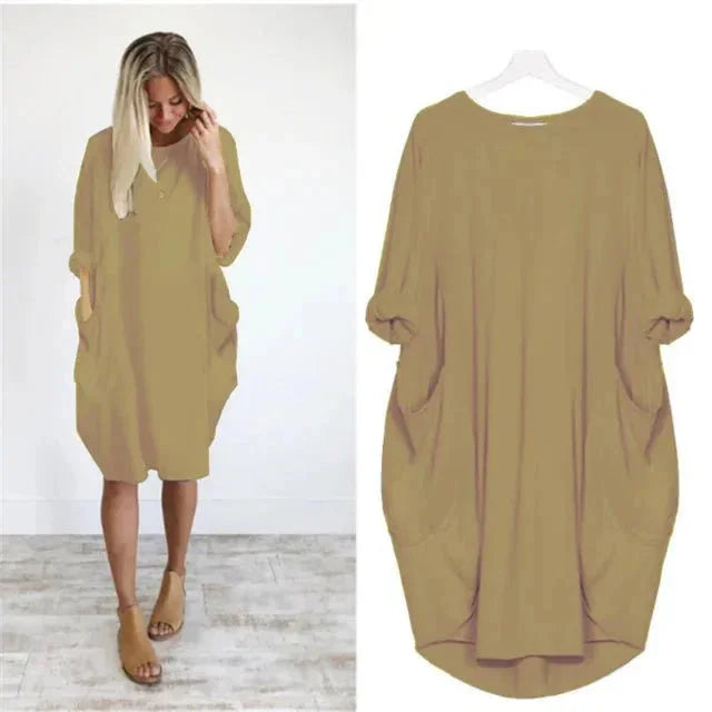 Soft, comfortable women's oversized midi dress, flowy design, with 3/4 sleeves & functional pockets.