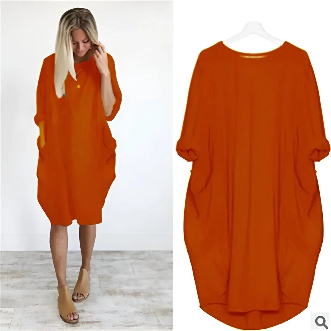 Detail: Comfortable 3/4 sleeves on a women's oversized midi dress, also featuring convenient pockets.