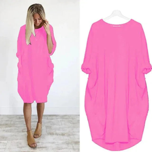 Woman models a comfortable oversized midi dress with 3/4 sleeves, perfect for casual everyday wear.