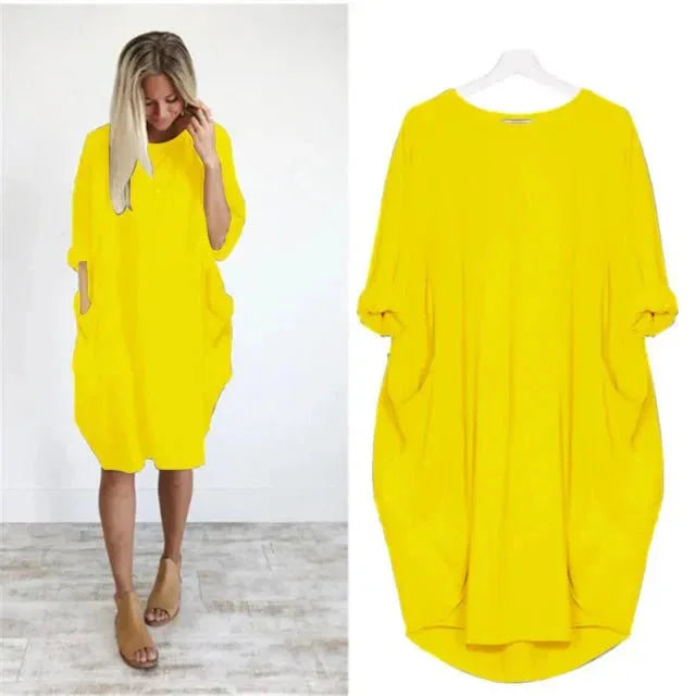 Elegant women's oversized midi dress with 3/4 sleeves, featuring a comfortable fit & practical pockets.