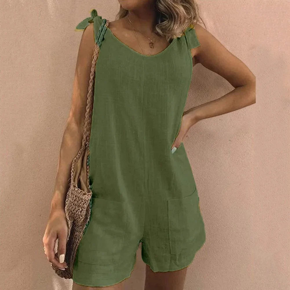 Easy-wear women's short romper with trendy bow straps & handy pockets, versatile for daily or vacation wear.