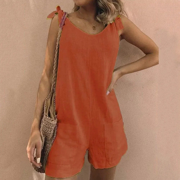 Comfortable women's short romper with bow tie straps & pockets, ideal lightweight one-piece for summer vacation.