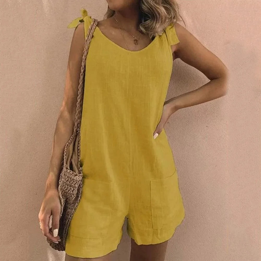 Stylish women's casual short jumpsuit featuring delicate bow straps & functional patch pockets for a chic look.