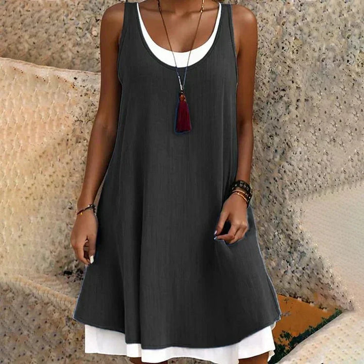 Women's casual summer layered mini dress with a scoop neck and sleeveless design, perfect for vacation or everyday.