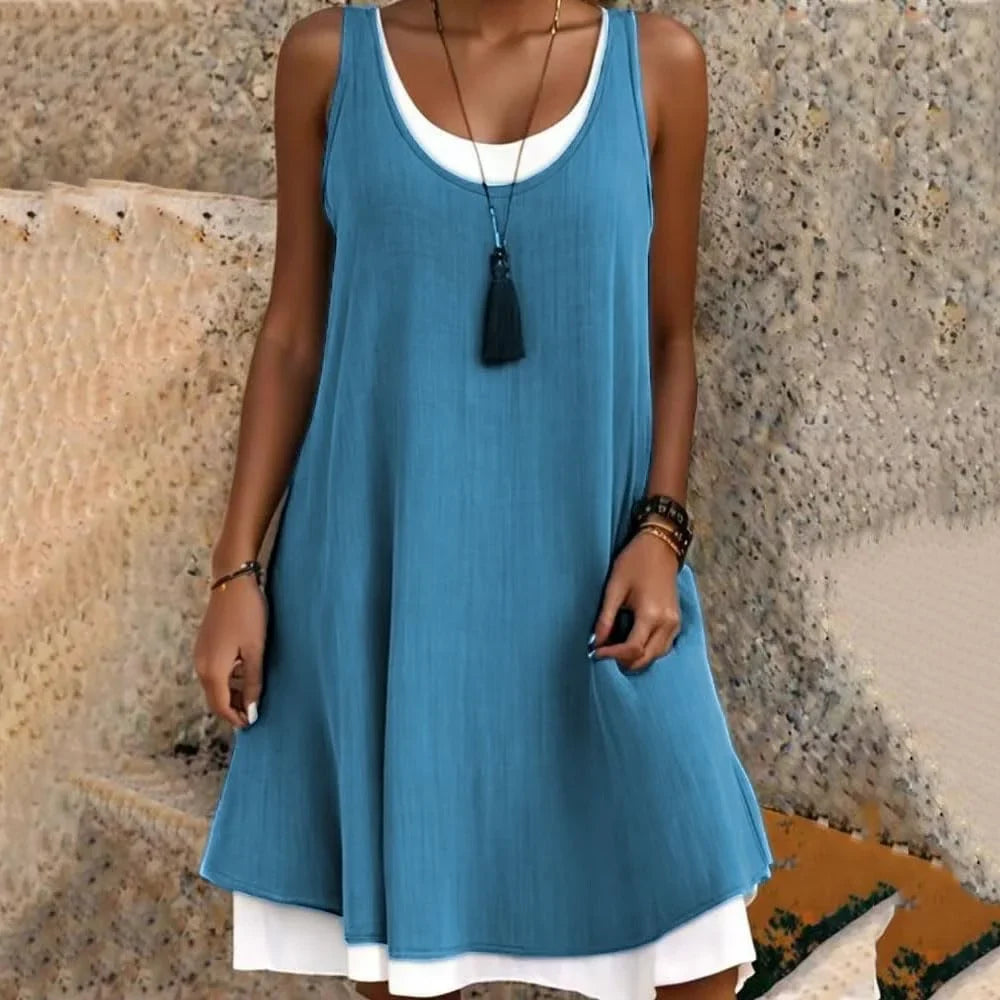 Sleeveless A-line mini dress for women, casual layered style with scoop neck, ideal for summer travel and outfits.