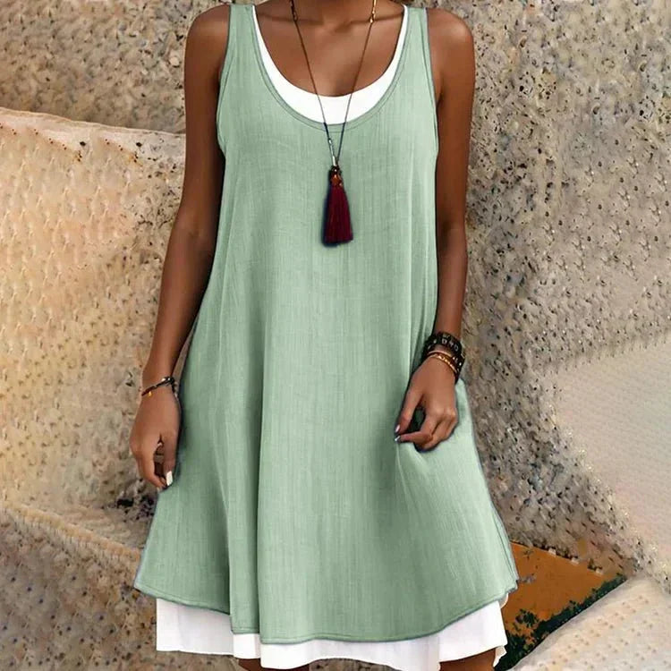 Trendy layered mini dress for women, casual sleeveless scoop-neck design, a perfect choice for summer vacations.