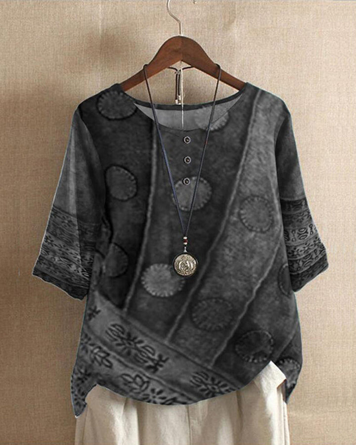 Woman wearing a grey chic blouse, elegant and comfortable, suitable for work or casual outings, flattering fit.