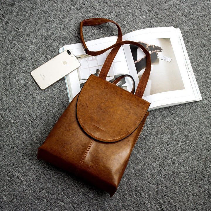 "Women's chic leather backpack, minimalist design, high-quality leather, adjustable straps, versatile for work and travel."