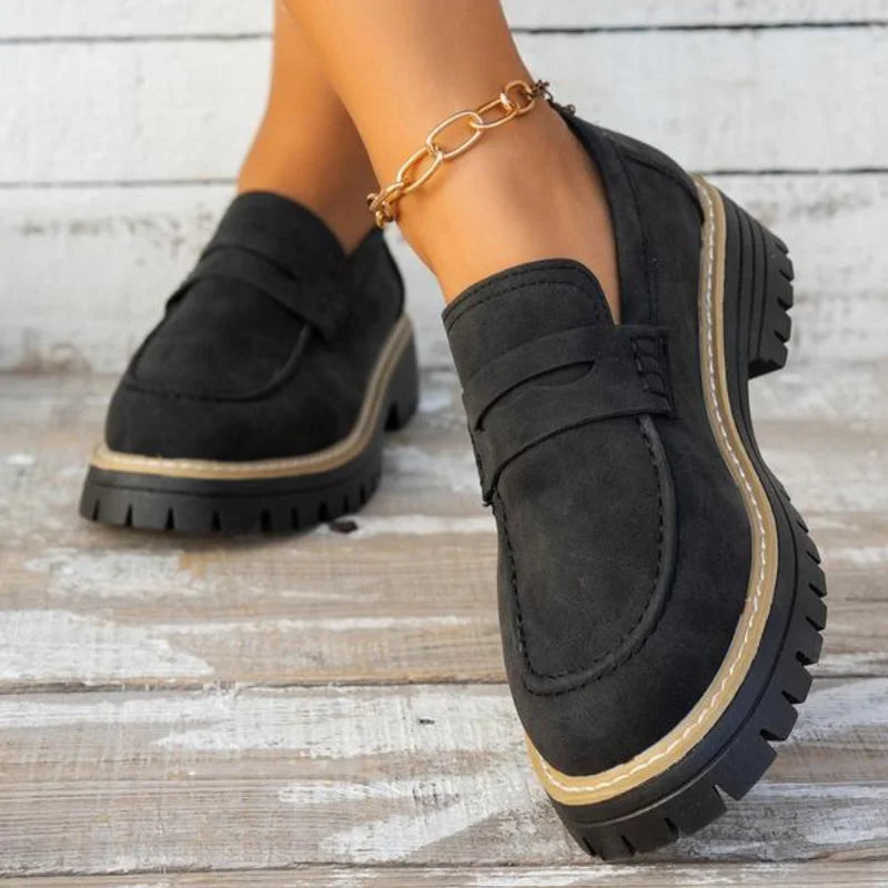 Women's slip-on chunky platform loafers featuring a classic penny strap. Versatile shoes for fashion & comfort.