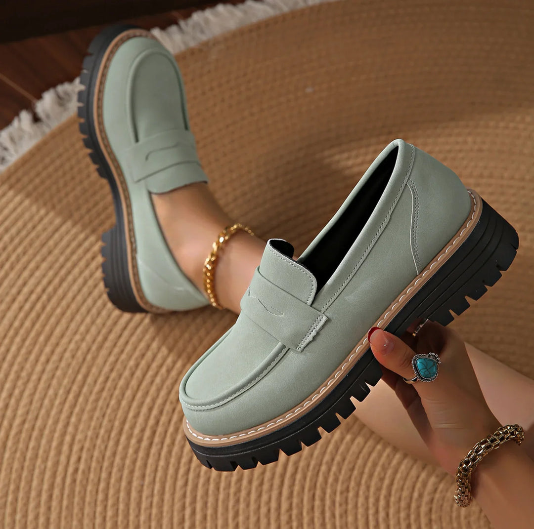 Comfortable women's platform loafers. Chunky slip-on design with penny strap, perfect for modern casual looks.