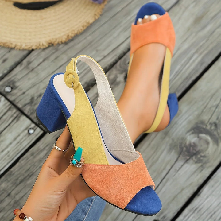 Women's color-block open-toe block-heel sandals with elegant slingback strap. Chic summer footwear.