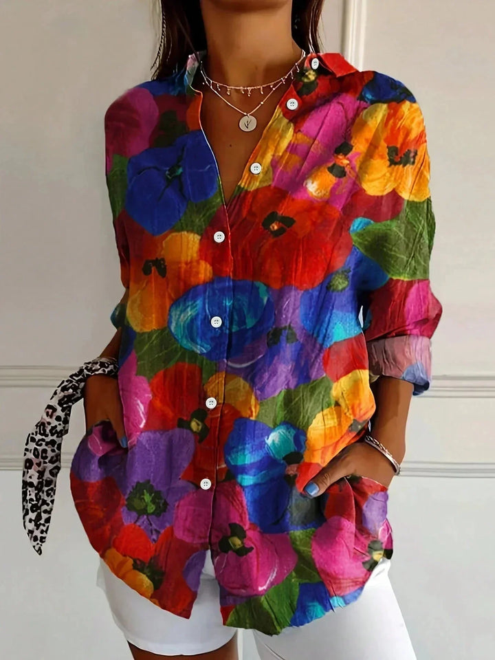 Artistic and vibrant long sleeve women's blouse, featuring a stunning floral print and loose, elegant fit.