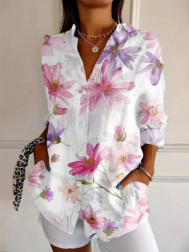 Vibrant floral print women's long sleeve blouse with a stylish button front design & comfortable loose fit.