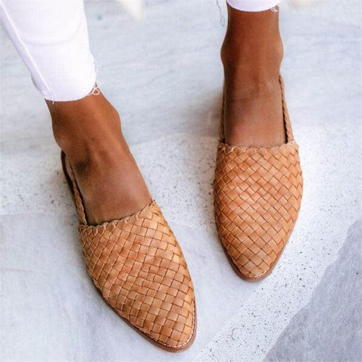 "Women's comfortable woven leather slingback flats, closed toe, with secure strap and elegant design for versatile wear."