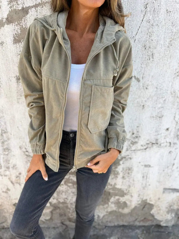 Stylish women's corduroy quilted jacket with hood & zip-up front. Oversized fit for comfortable fall & spring outerwear.