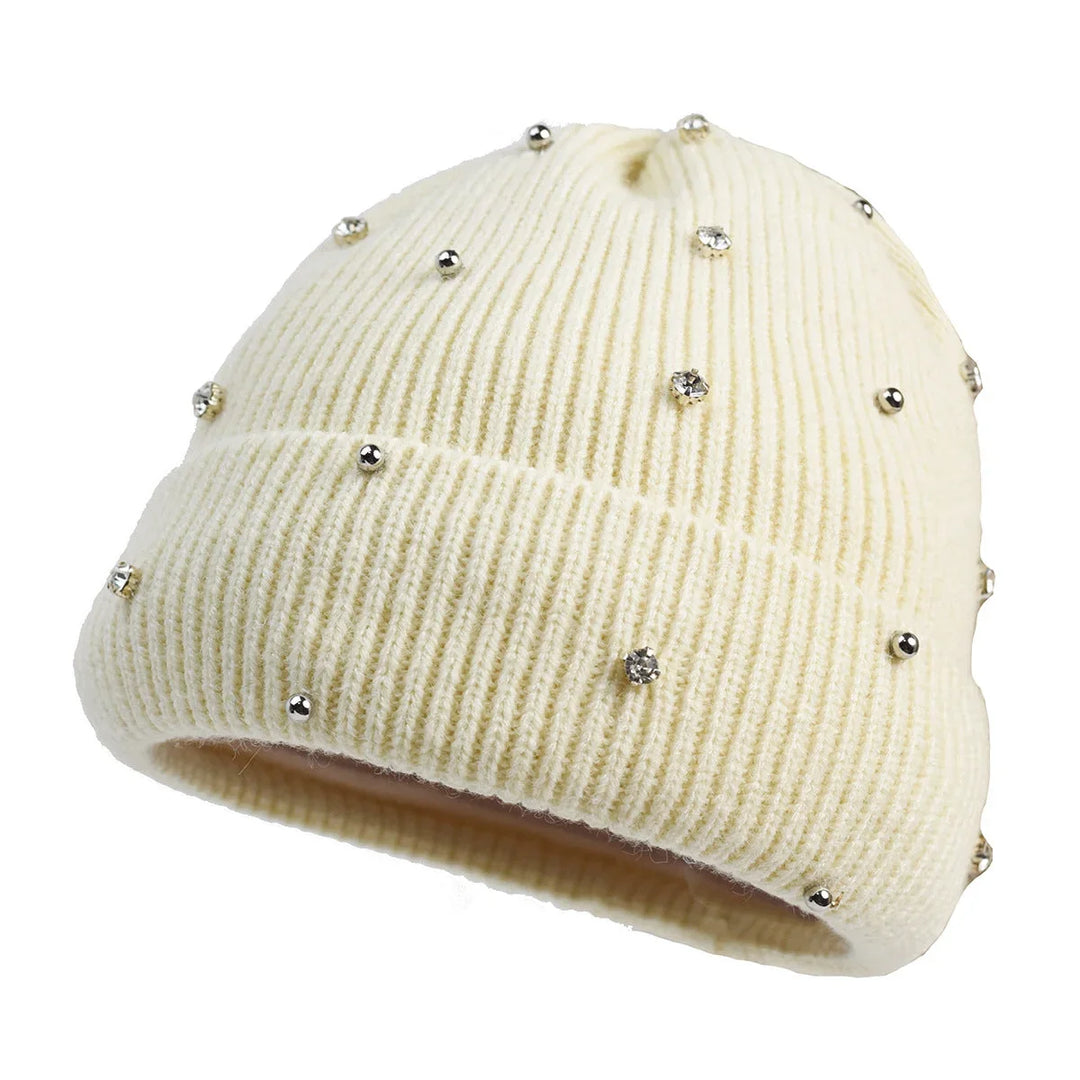 Close-up of a women's sparkle beanie, highlighting intricate embellishments and a soft knit texture.