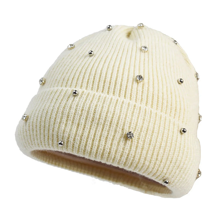 Close-up of a women's sparkle beanie, highlighting intricate embellishments and a soft knit texture.