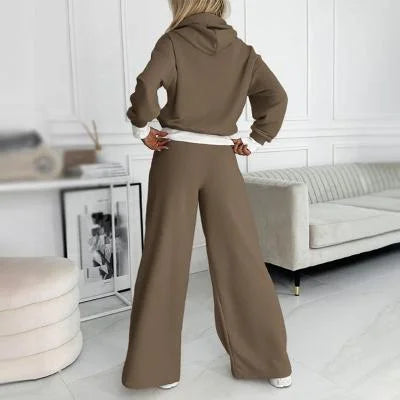 Chic women's two-piece loungewear set featuring a drawstring hoodie and relaxed wide-leg pants for ultimate comfort.