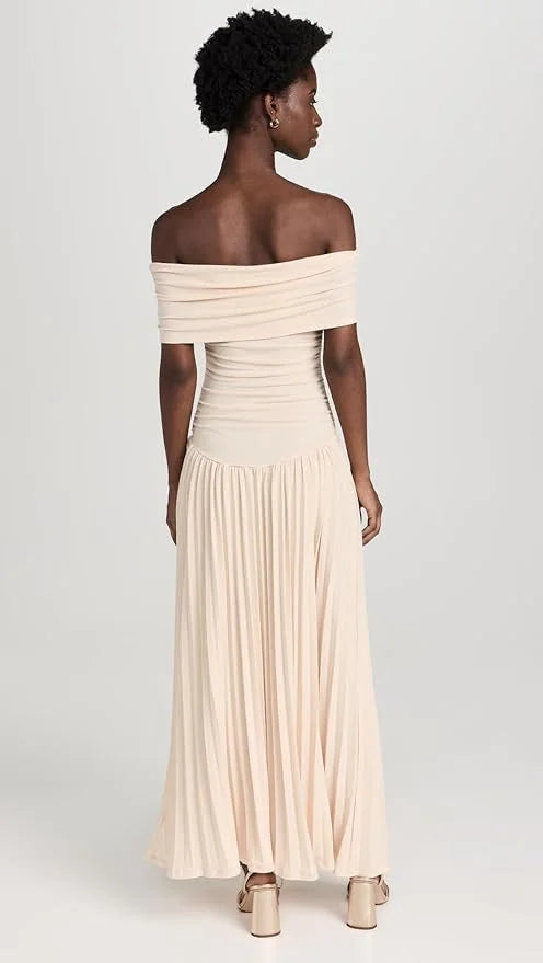 Detail of the off-shoulder neckline on a women's cream maxi dress, elegant and stylish summer wear.