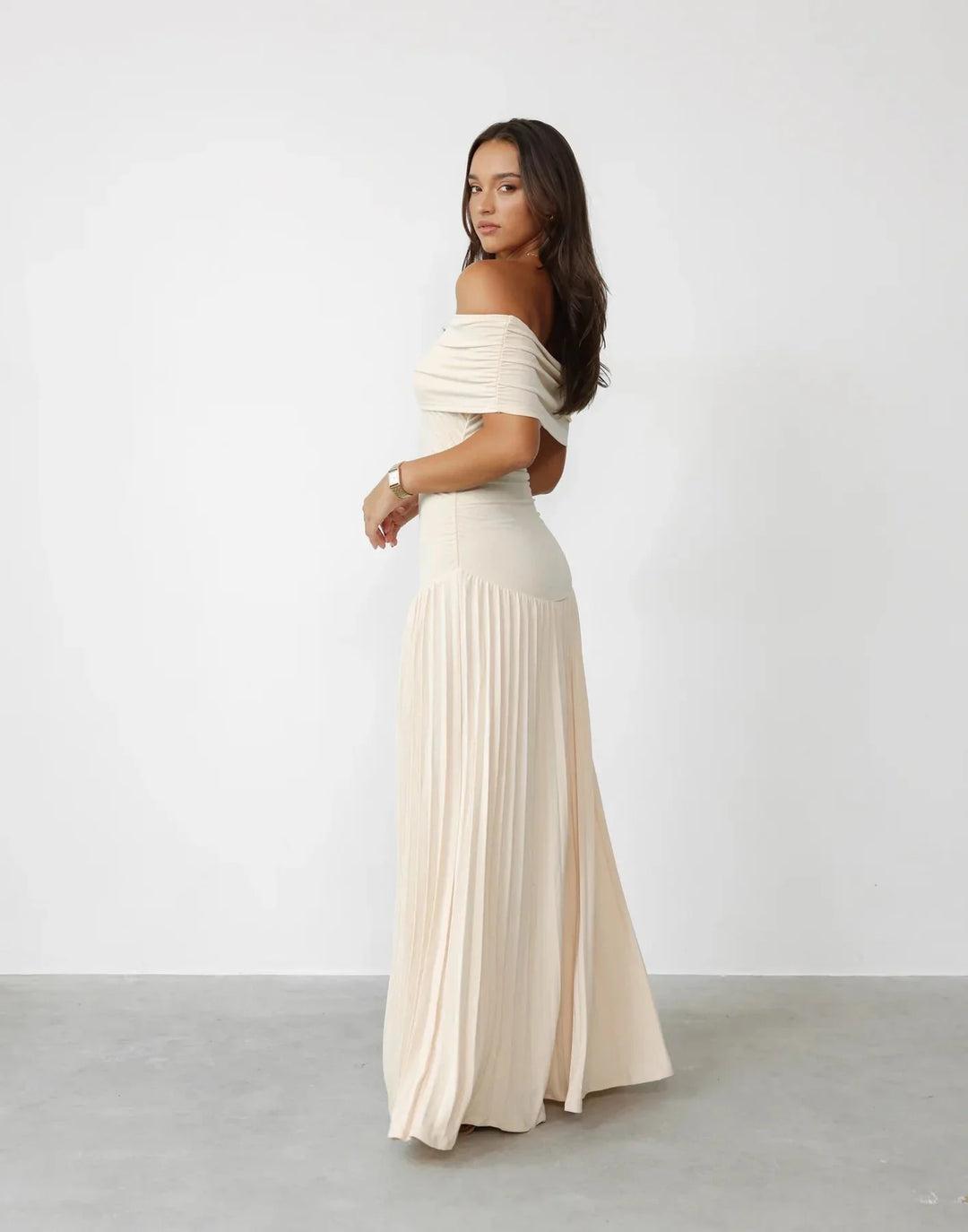 Comfortable women's cream off-shoulder maxi dress, flowy summer style for casual and elegant occasions.