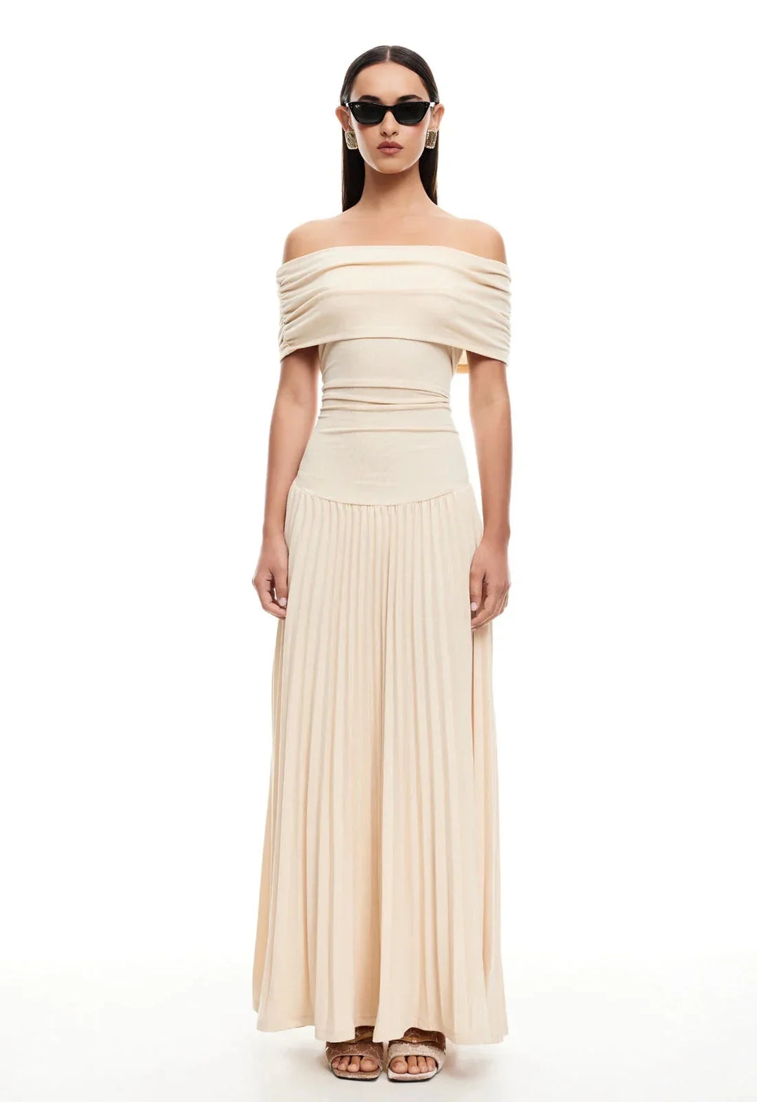Flowy cream off-shoulder maxi dress for women, featuring a comfortable fit and stylish pleated skirt.