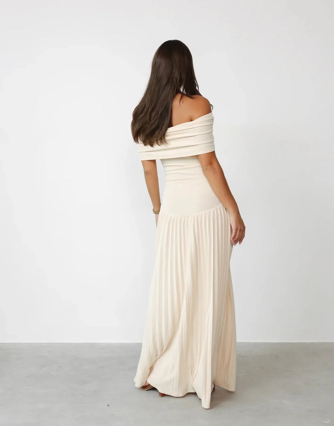 Elegant cream off-shoulder maxi dress for women, ideal for summer special occasions or vacation wear.