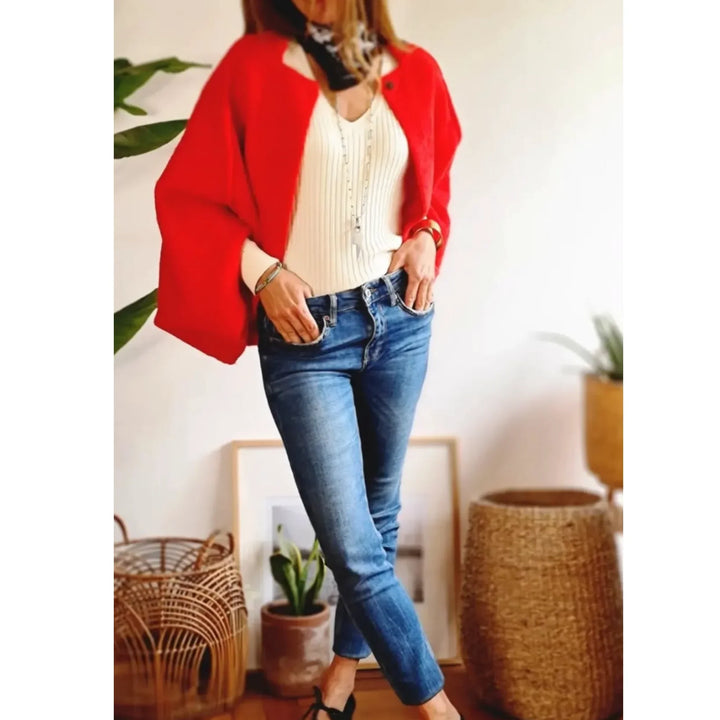 Comfortable women's cropped knit cardigan. Soft fabric, wide sleeves, stand collar. Outerwear fashion.