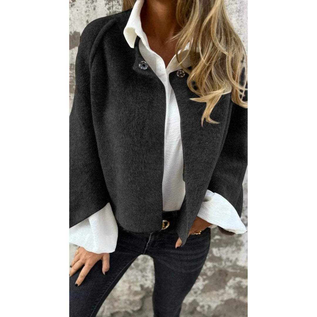 Fashionable women's cropped knit cardigan. Soft fabric, wide sleeves, stand collar. Casual comfort.