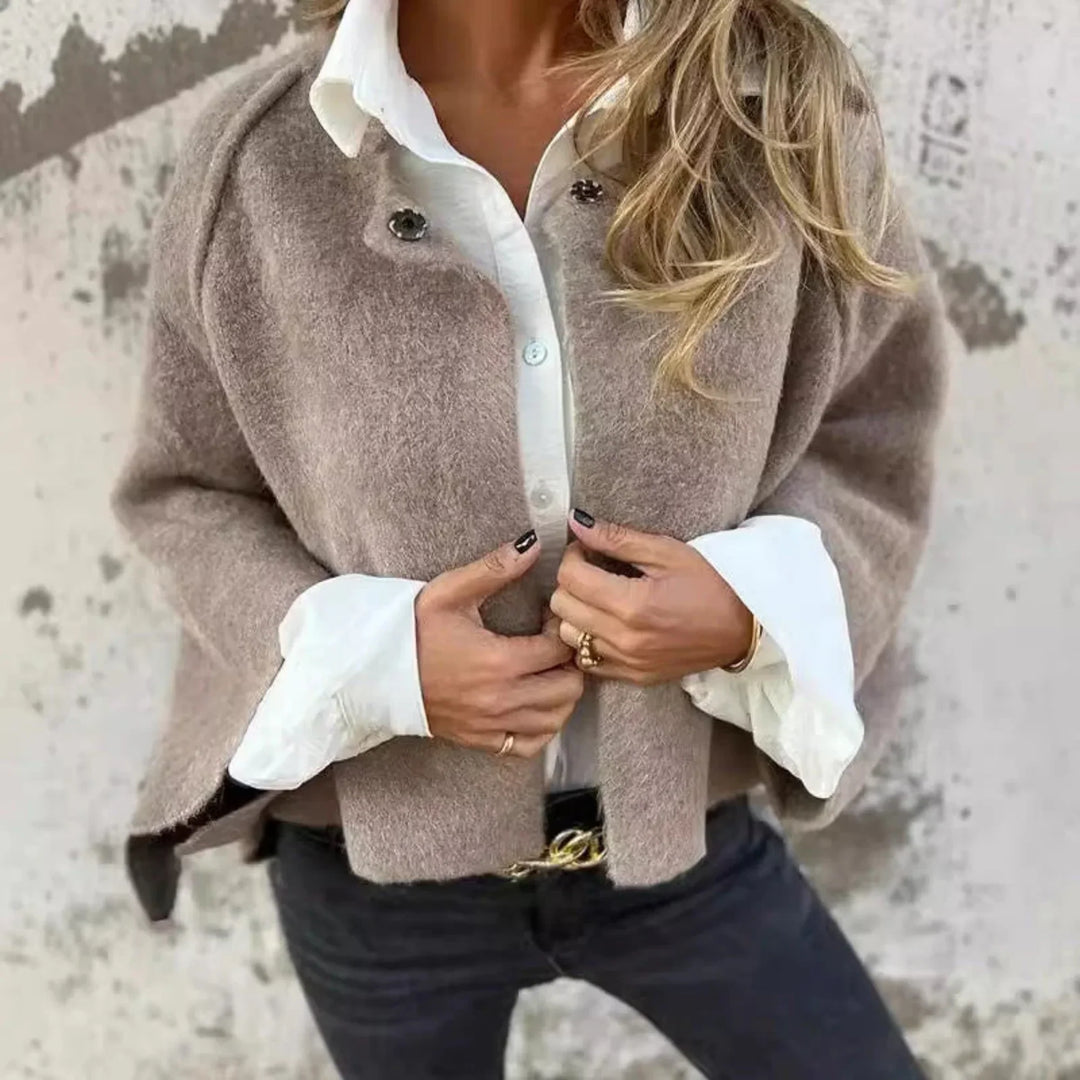 Soft knit women's cropped cardigan. Wide sleeves, stand collar design. Stylish layering piece.