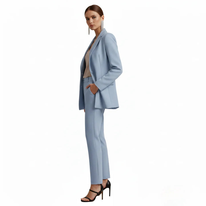 Tailored women's blazer and trousers two-piece suit, elegant business casual wear.