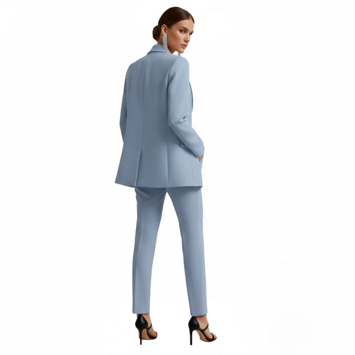 Professional women's tailored double-breasted blazer and trousers set for business attire.