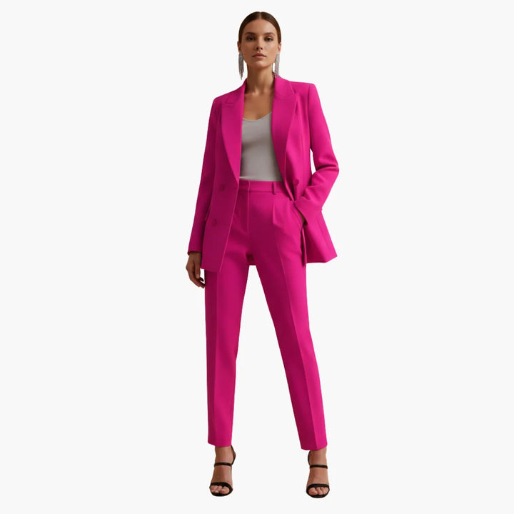 Women's elegant professional suit featuring a double-breasted blazer and tailored trousers.