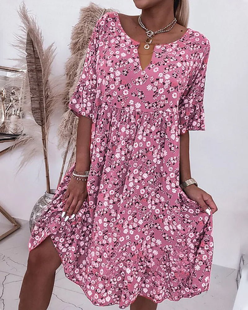 Women's elegant floral V-neck midi dress, vibrant pattern, flattering fit, perfect for garden parties and casual outings.
