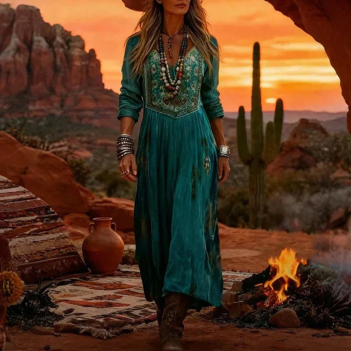 Teal long sleeve V-neck maxi dress for women, with intricate bohemian embroidery. A chic choice for spring/summer.