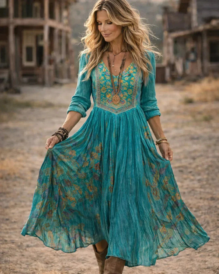 Stylish women's boho maxi dress, featuring delicate embroidery, V-neckline, & long sleeves. Great for fashion.