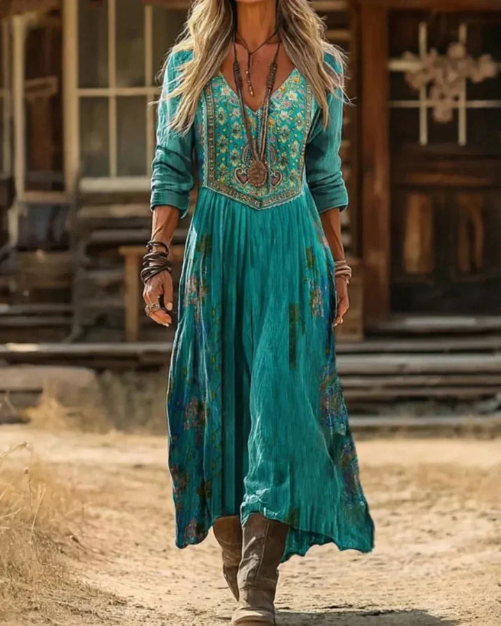 Women's teal embroidered boho maxi dress with V-neck & long sleeves, ideal for elegant spring occasions.