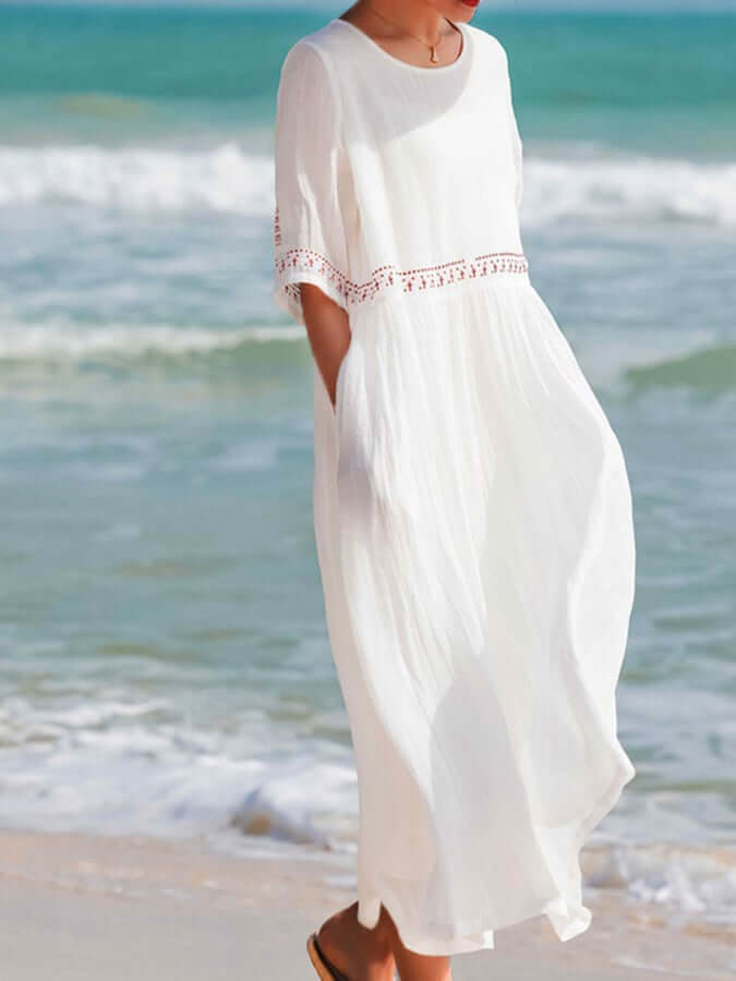 "Women's embroidered loose dress with cotton linen blend, intricate embroidery detailing, comfortable and elegant look."